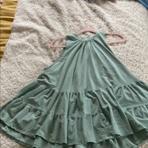 Long teal tank top with an opening in the back